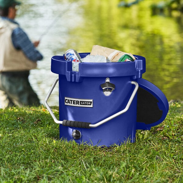 A navy CaterGator outdoor cooler filled with ice and drinks.