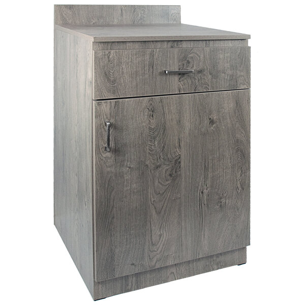 An American Tables & Seating gray wood host station cabinet with a drawer.