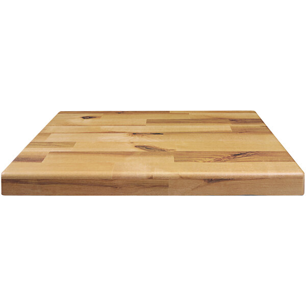An Elite Global Solutions faux wood rectangular riser on a wooden surface.