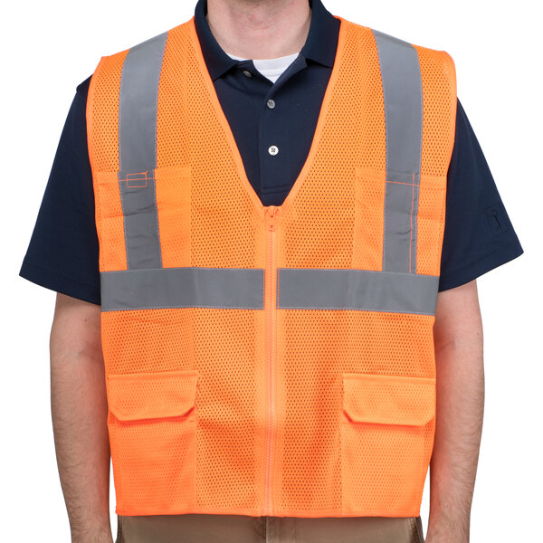 A Cordova orange high visibility safety vest with reflective stripes on a man.