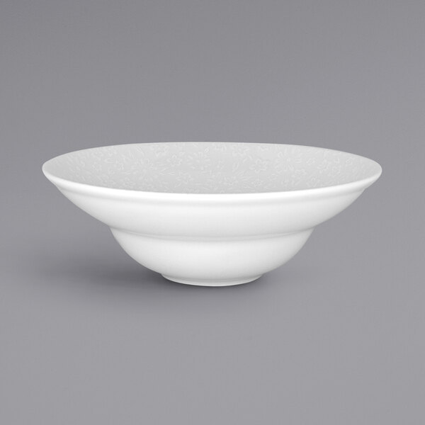 A white RAK Porcelain bowl with an ivory embossed pattern.