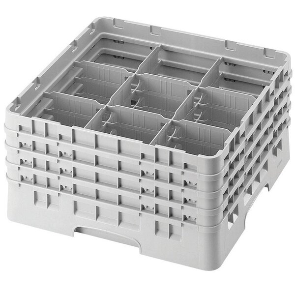 A soft gray plastic Cambro glass rack with 9 compartments and 3 extenders.