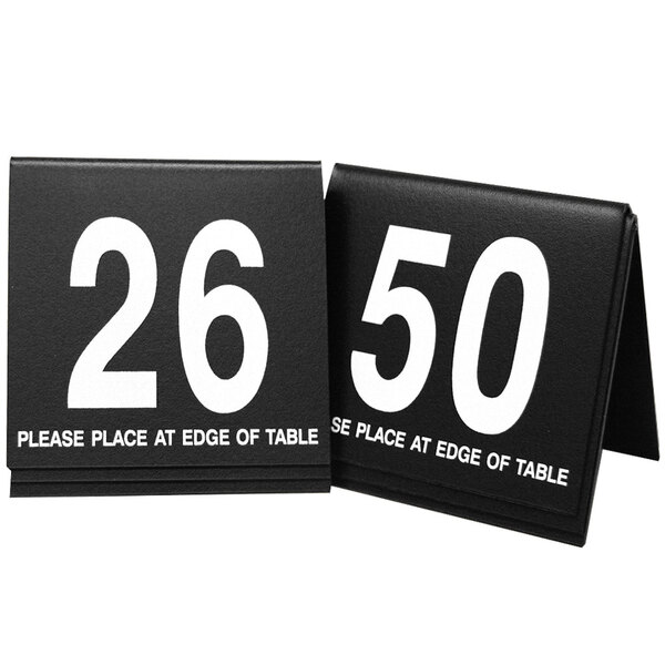 Two black Cal-Mil table tents with white numbers 26-50.