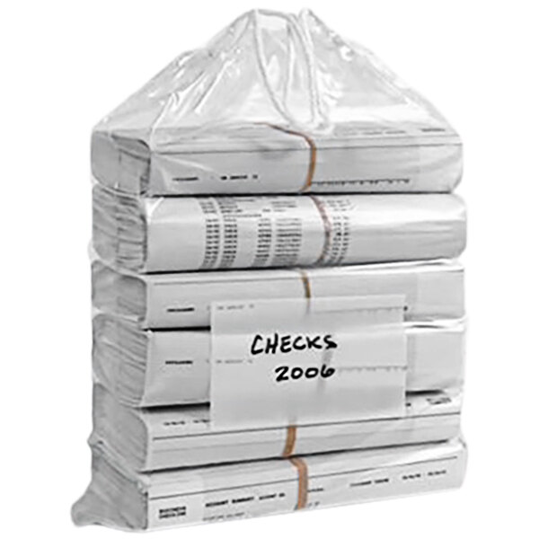 A stack of clear drawstring bags filled with papers on a white surface.
