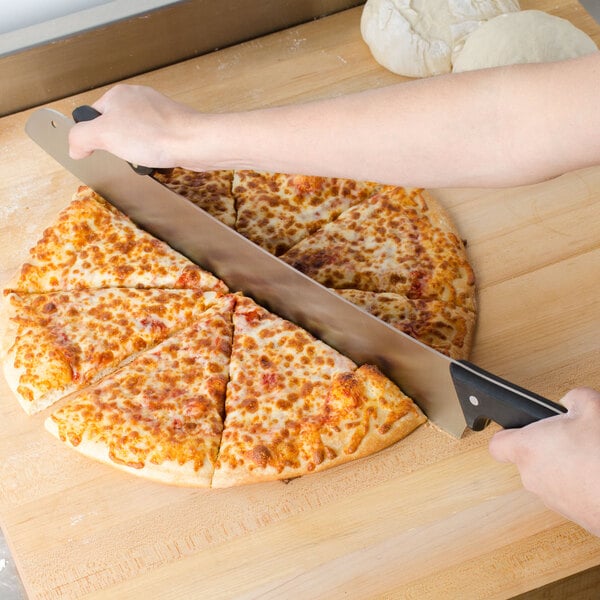 A person using an American Metalcraft double POM handle pizza knife to cut a pizza.