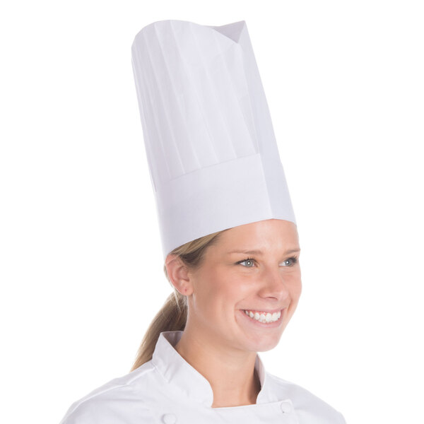 A woman wearing a Royal Paper white disposable chef hat.