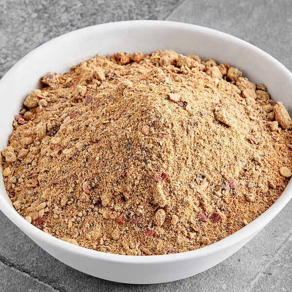 A bowl of ground meat mixed with brown Regal Sweet and Salty Jerky Seasoning.