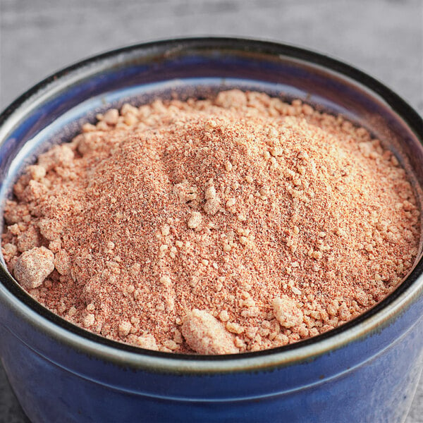 A bowl of Regal Maple Chipotle Wing Rub powder on a table.