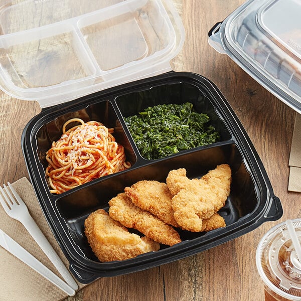 A black Choice plastic container with three compartments filled with food.