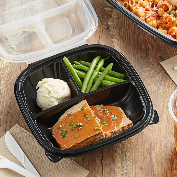 A Choice plastic container with three compartments holding pasta, meat, and white food.