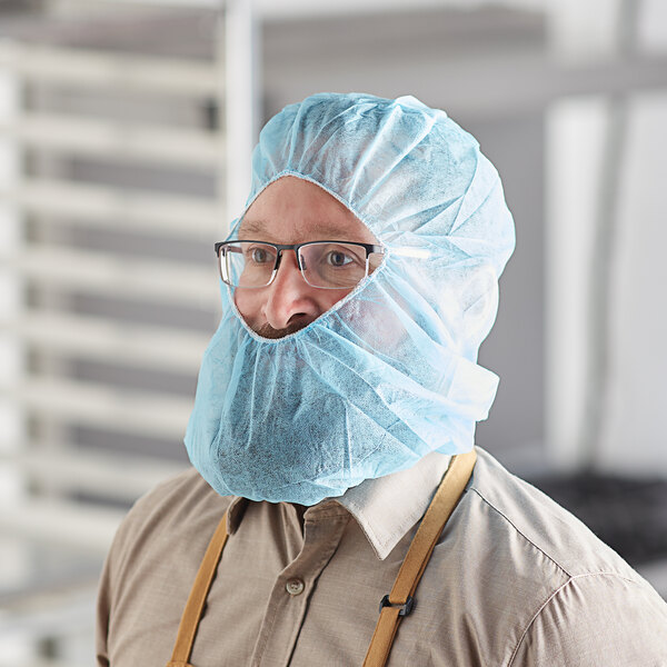 A man wearing a blue Malt PolyLite polypropylene hood.