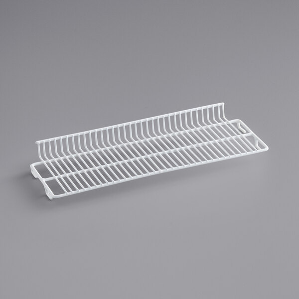 A white wire rack for an Avantco countertop display freezer.