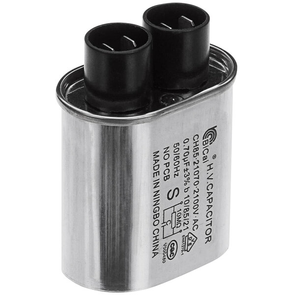 A silver Solwave capacitor with black wires.