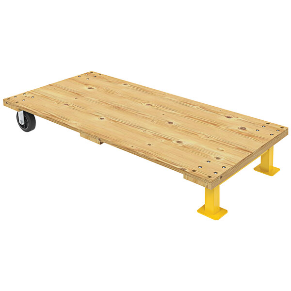 A wooden platform with yellow wheels on it.