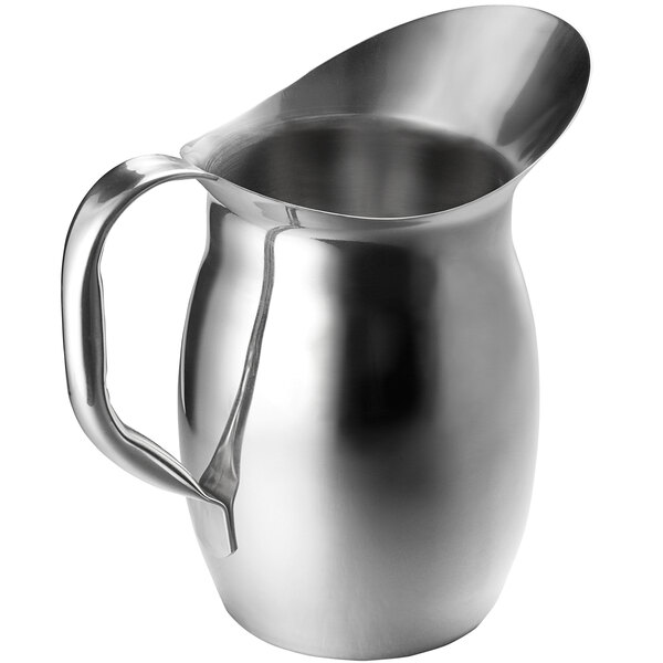 A Tablecraft stainless steel pitcher with a handle.