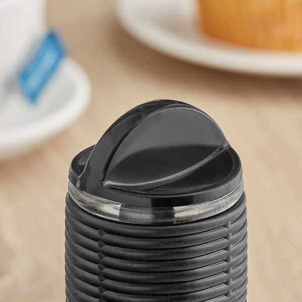 A black plastic container with a black Tablecraft Hottle lid.