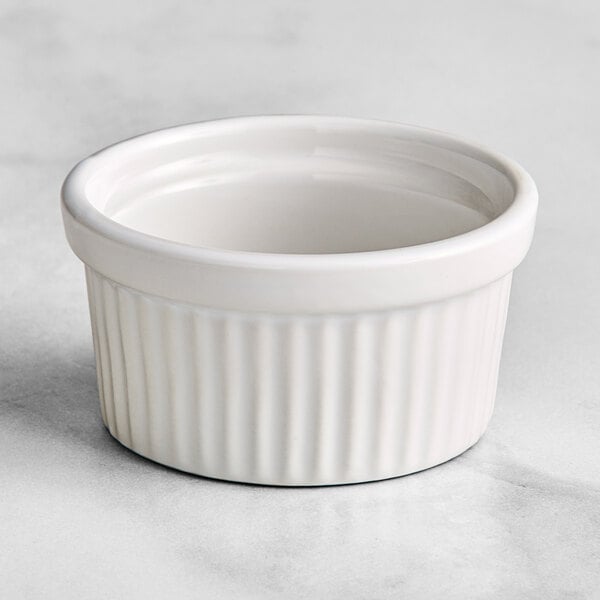 An American Metalcraft replacement ramekin with a lid on a white surface.