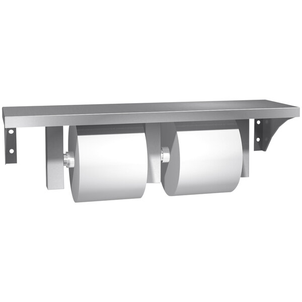 A stainless steel American Specialties, Inc. double toilet tissue holder with shelf holding two rolls of toilet paper.