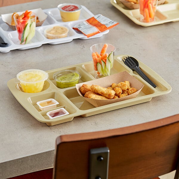 A tan Choice compartment tray with food on it.