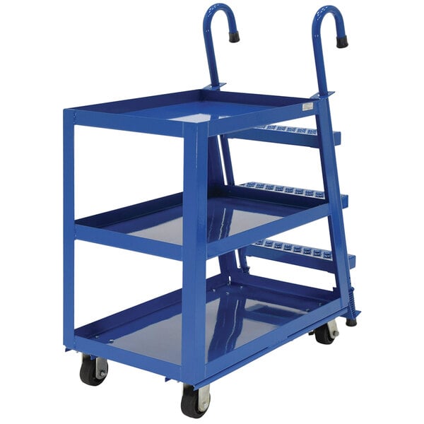A blue steel Vestil stock picker cart with three shelves.