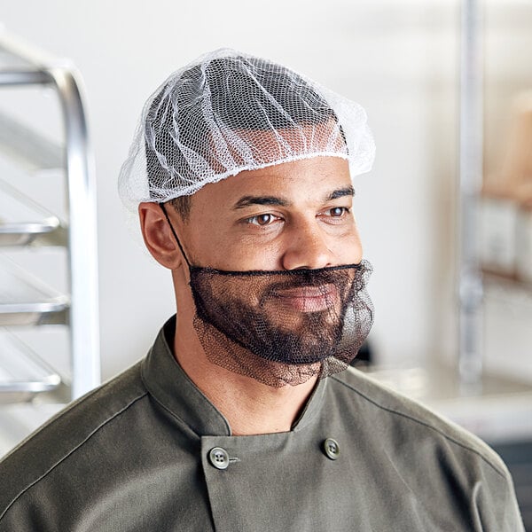 A man wearing a white Choice nylon hairnet.