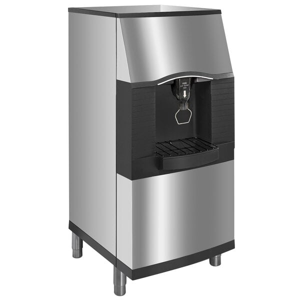 A stainless steel Manitowoc touchless ice dispenser with a black door.