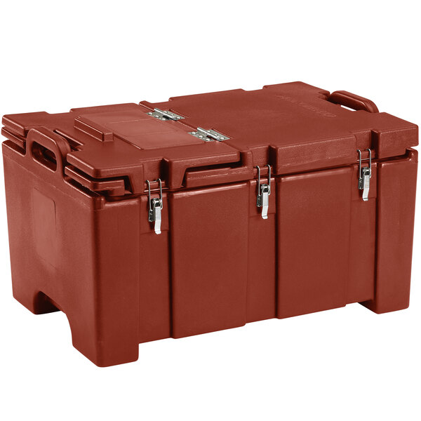 A close up of a Cambro brick red top loading food pan carrier with hinged lid.