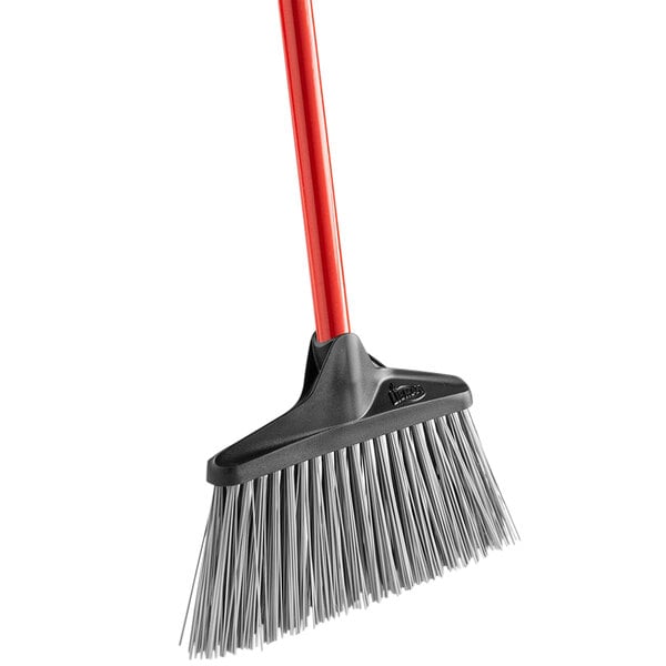 A red and black Libman 10" stiff sweep unflagged lobby broom with a red handle.