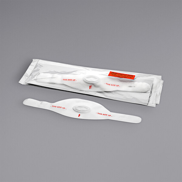 A package of 50 white circular plastic face shields with red arrows on the packaging.