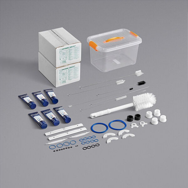 A Spaceman starter kit with blue tubes and a plastic container with orange handles.