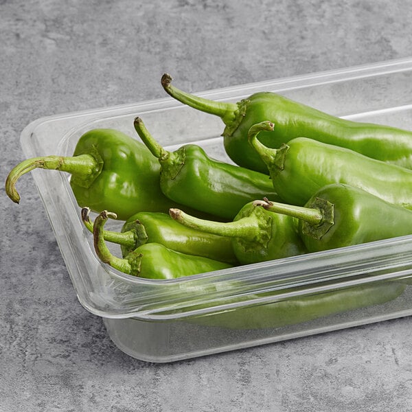 A container of Fresh Anaheim Peppers with green stems.