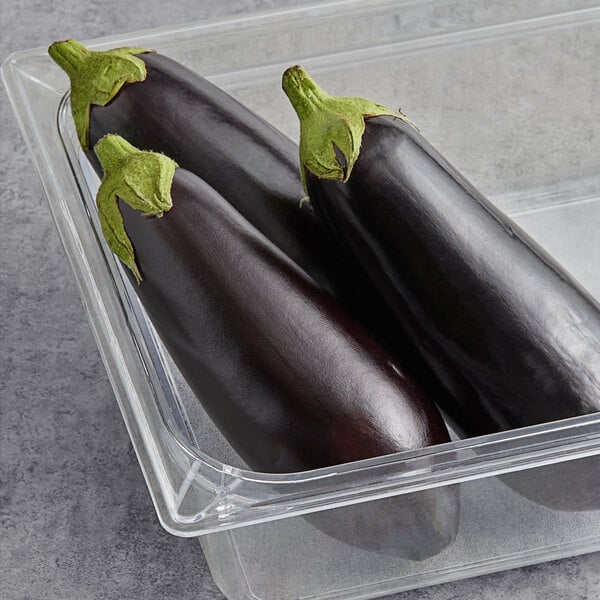 Fresh Baby Eggplant in a plastic container.