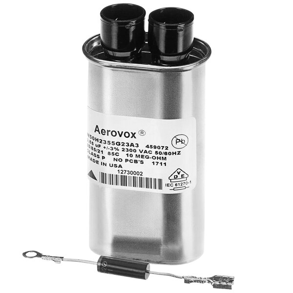 A silver capacitor with black and white labels and a black handle.