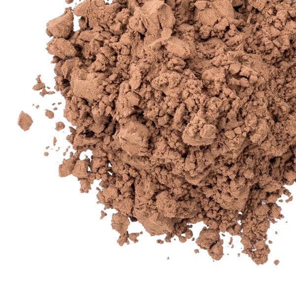 A pile of Dutch cocoa powder on a white background.