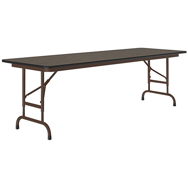 A rectangular Correll folding table with a walnut thermal-fused laminate top and a brown metal frame.