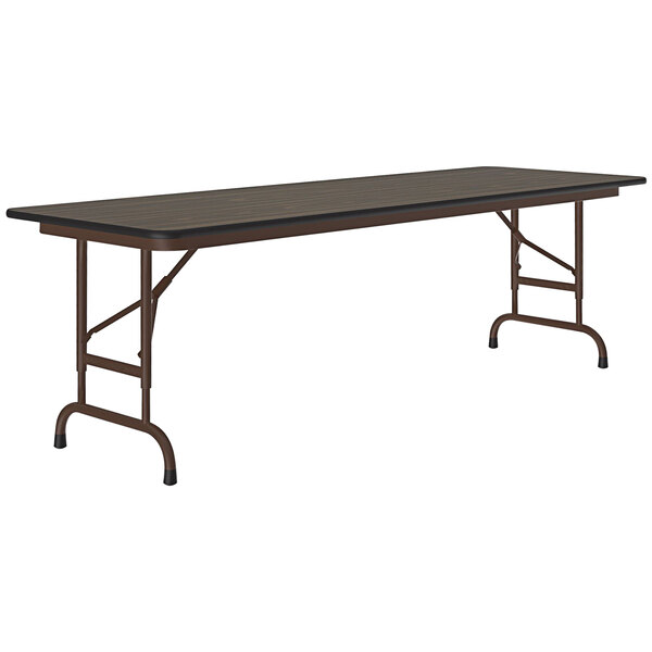 A Correll walnut folding table with a metal frame.