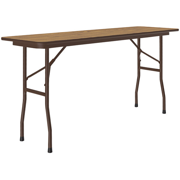 A Correll folding table with a medium oak wooden top and brown frame.