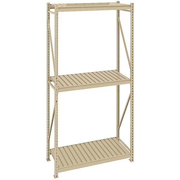 A tan Tennsco boltless shelving unit with corrugated decking on three shelves.