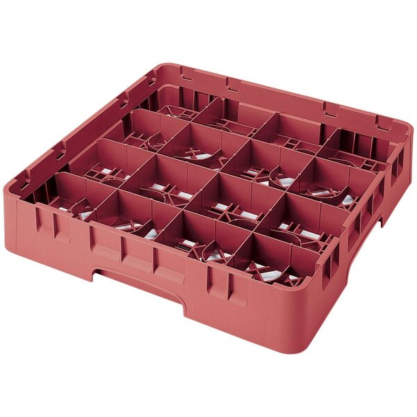 A red plastic container with many compartments for glasses.
