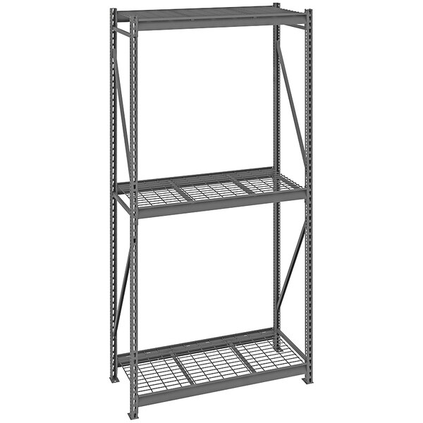 A dark grey Tennsco bulk storage rack with wire decking.