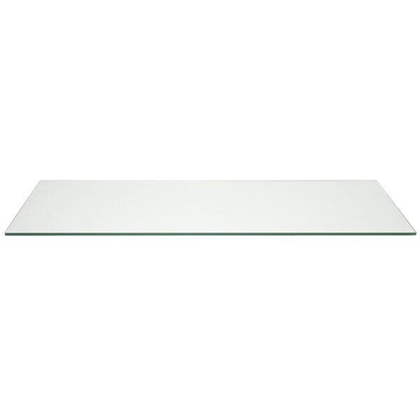 A clear rectangular glass buffet board on a white table.