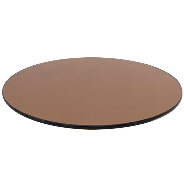 A round brown table top with black edges.