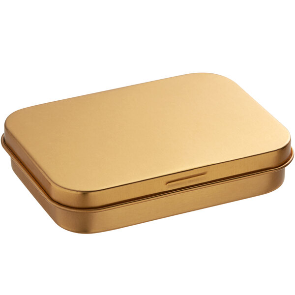 A 2 3/4" x 3 3/4" x 3/4" gold rectangular metal tin with a slip cover.