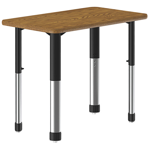 A Correll rectangular medium oak table with black legs.