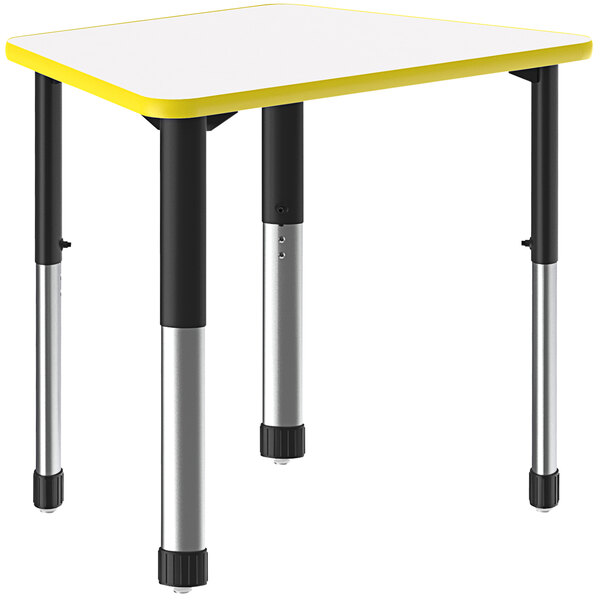 A white trapezoid-shaped Correll collaborative desk with a yellow band on black legs.