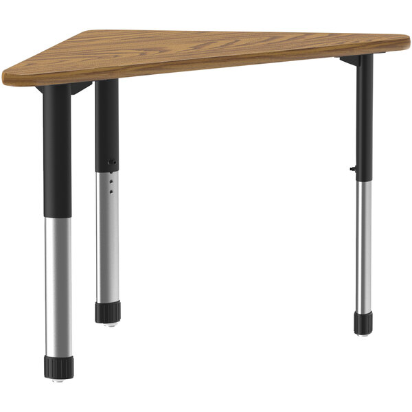 A triangular medium oak table with black legs.