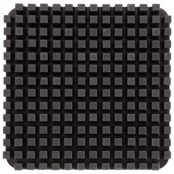 A black Nemco push block with small squares on it.