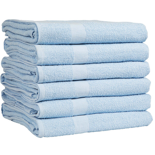 A stack of light blue Monarch Brands pool towels.