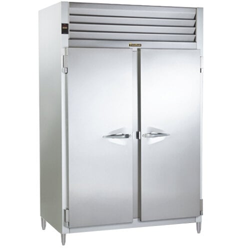 A Traulsen white metal refrigerator with two solid doors.