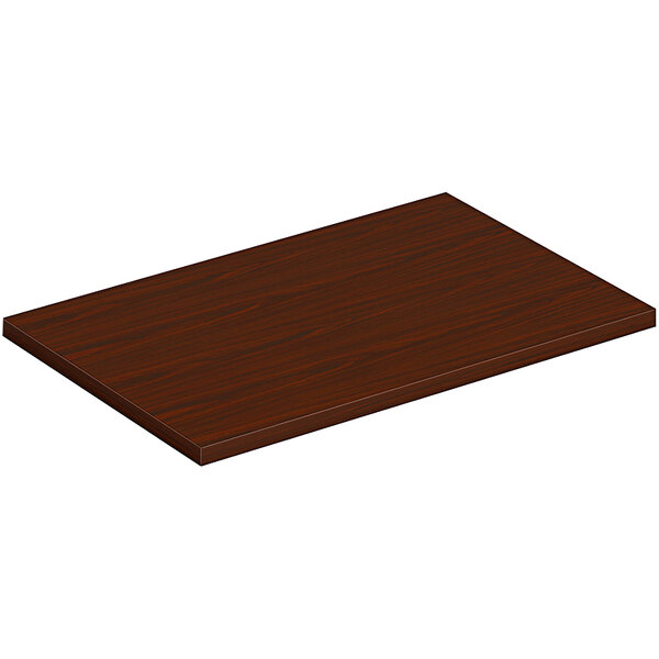A rectangular wood table top in a mahogany finish.